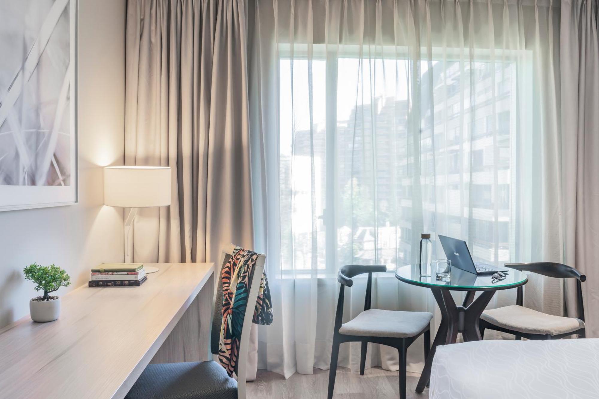 Pullman Santiago Vitacura Εξωτερικό φωτογραφία A room at the hotel
